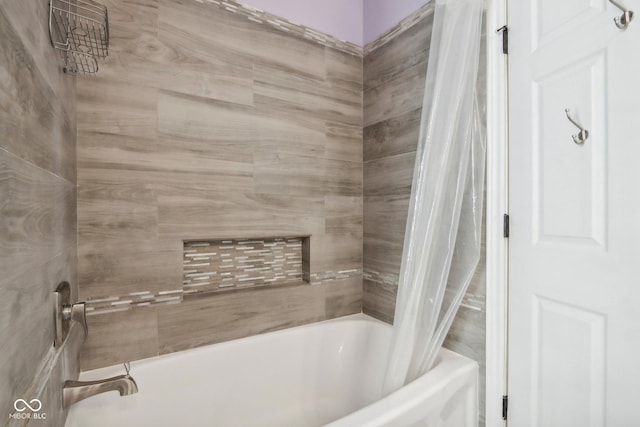 bathroom with shower / bath combo with shower curtain