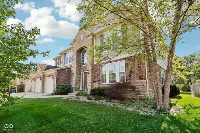 front facade featuring a garage and a front lawn