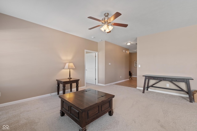 living room featuring ceiling fan and light colored carpet