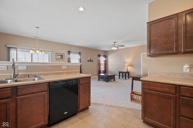 kitchen with sink, ceiling fan with notable chandelier, dishwasher, decorative light fixtures, and light colored carpet