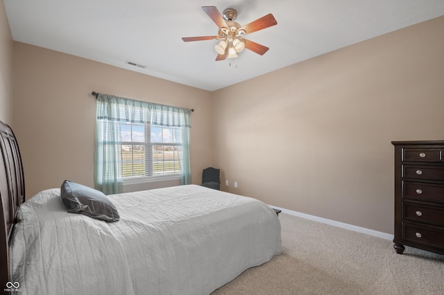 bedroom with light colored carpet and ceiling fan