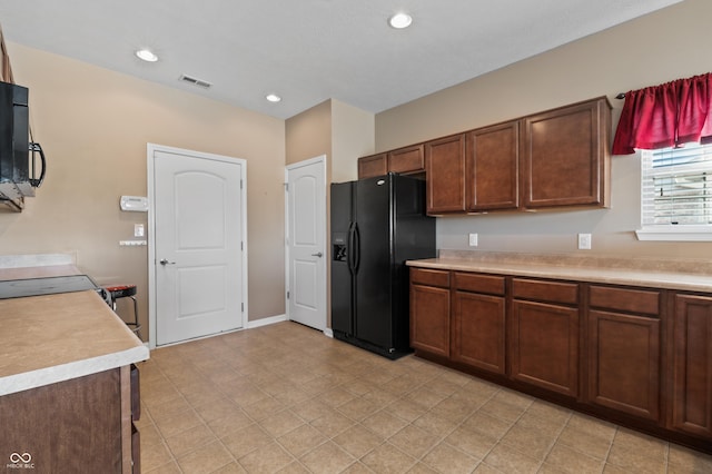 kitchen featuring black fridge