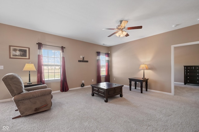 sitting room with light carpet and ceiling fan