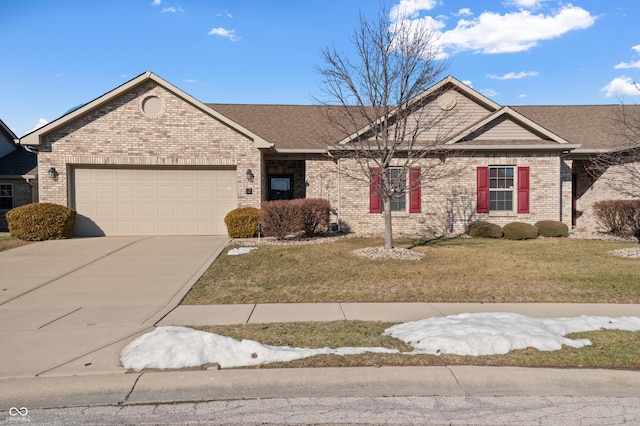 ranch-style house featuring a garage and a front lawn