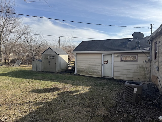 view of yard featuring cooling unit and a storage unit