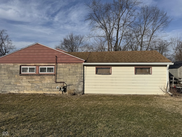 view of side of property with a lawn