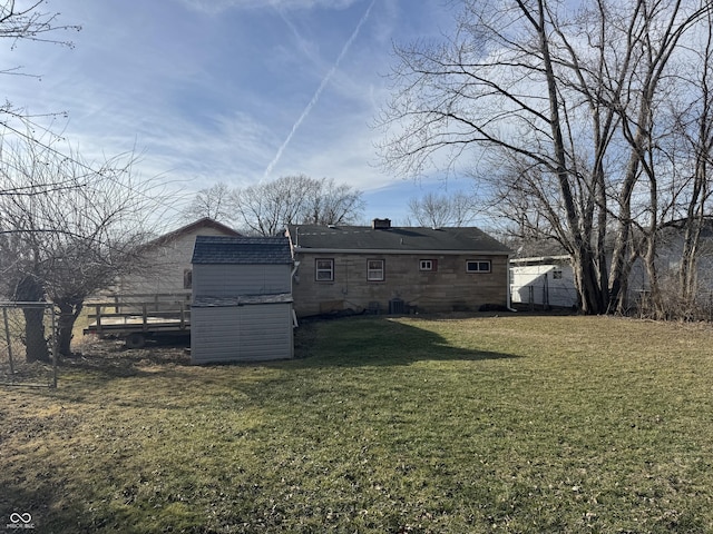 back of property featuring a yard