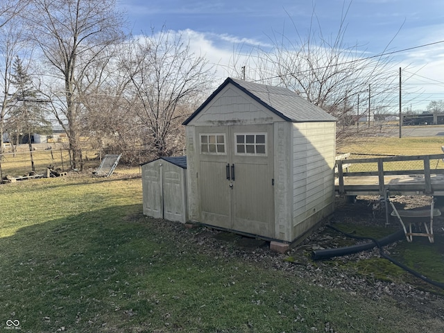 view of outdoor structure with a lawn