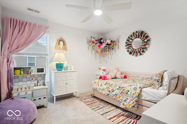 carpeted bedroom featuring ceiling fan