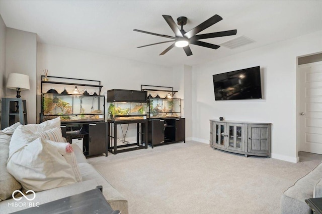 carpeted living room with ceiling fan