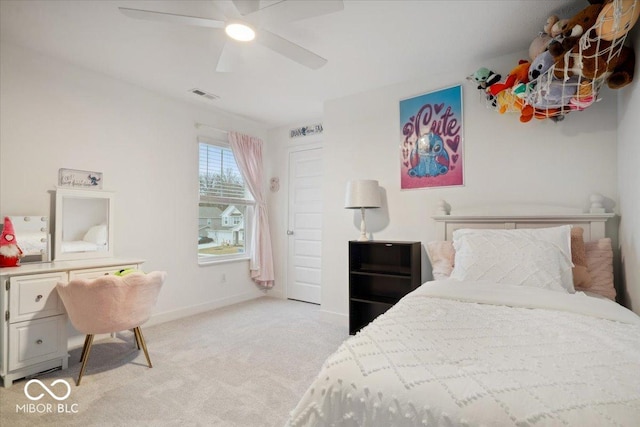 bedroom featuring light colored carpet and ceiling fan