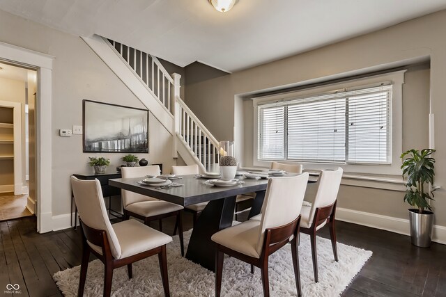 dining space featuring dark wood-type flooring