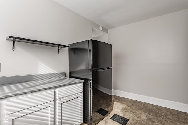 kitchen featuring black fridge