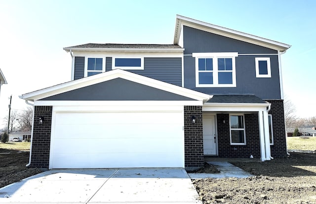 view of front of home featuring brick siding, concrete driveway, and a garage