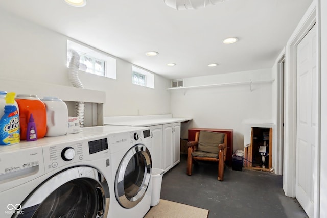 washroom with cabinets and independent washer and dryer