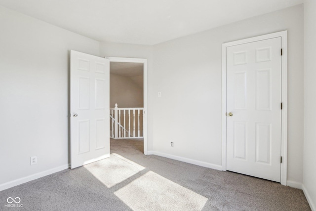 unfurnished bedroom with light carpet