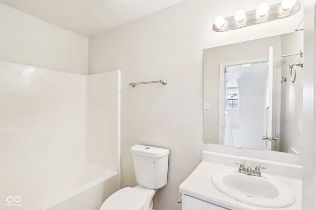 full bathroom with vanity, tub / shower combination, and toilet