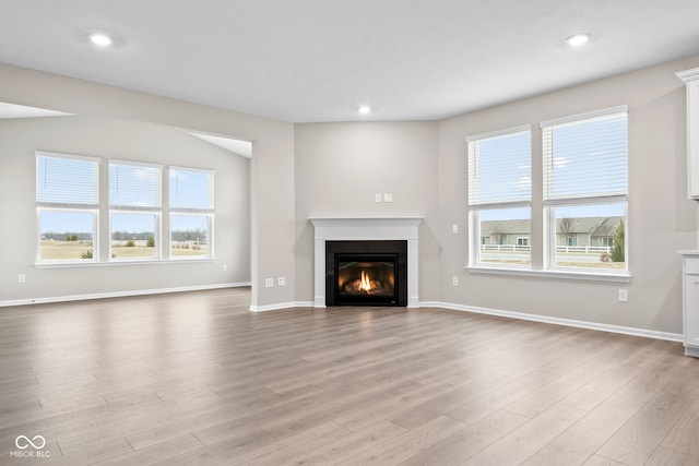 unfurnished living room featuring light hardwood / wood-style floors