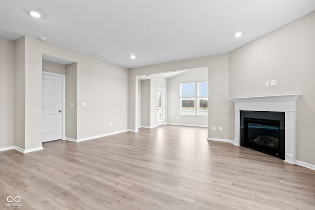 unfurnished living room with light wood-type flooring