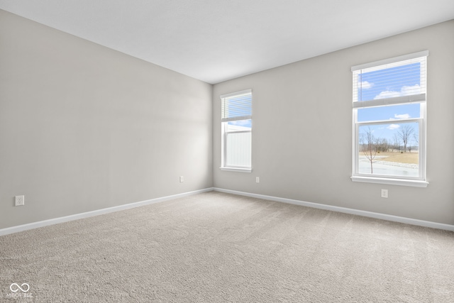 unfurnished room featuring carpet