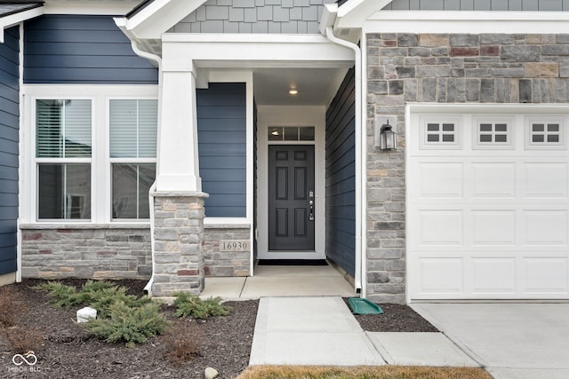 doorway to property featuring a garage