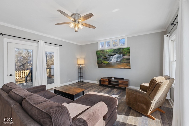 living room featuring crown molding, wood-type flooring, and ceiling fan