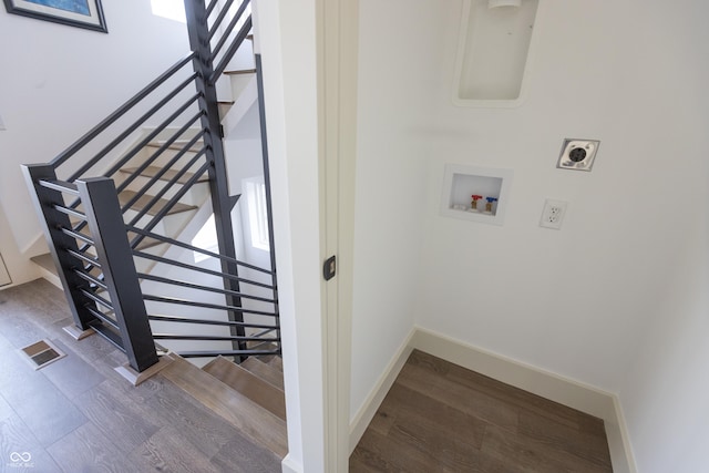 stairs featuring wood-type flooring