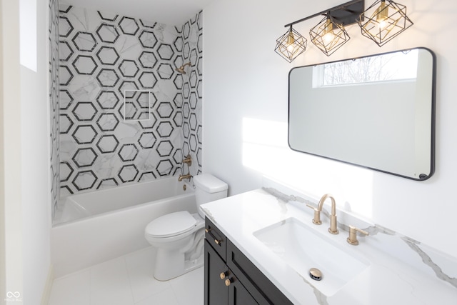 full bathroom with vanity, tile patterned flooring, tiled shower / bath combo, and toilet