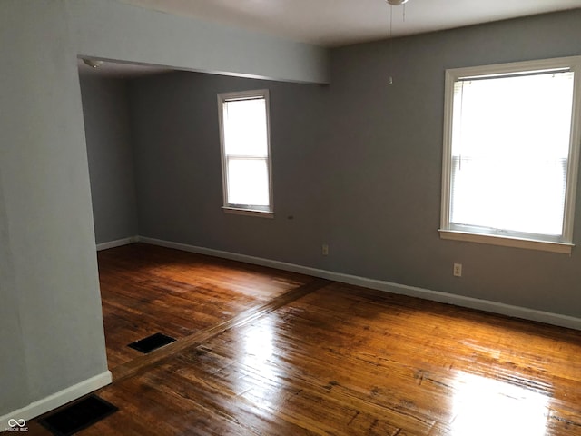 unfurnished room featuring wood-type flooring