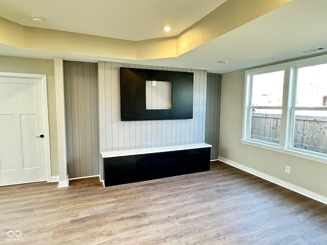 unfurnished living room with hardwood / wood-style flooring