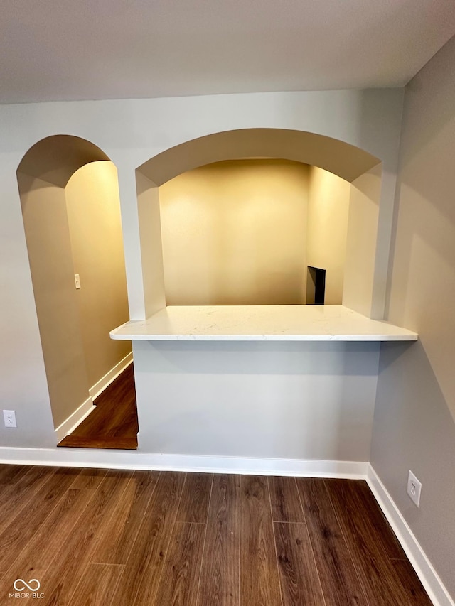 interior space with dark hardwood / wood-style floors