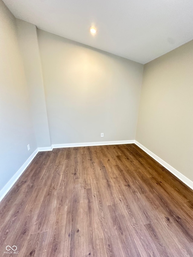 spare room featuring hardwood / wood-style floors