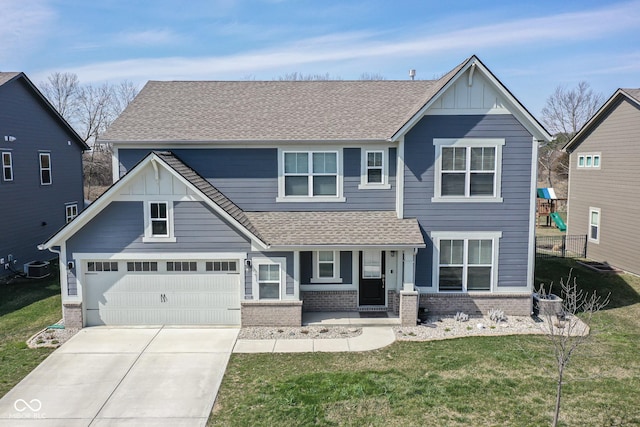 craftsman house with a garage, central AC, and a front yard