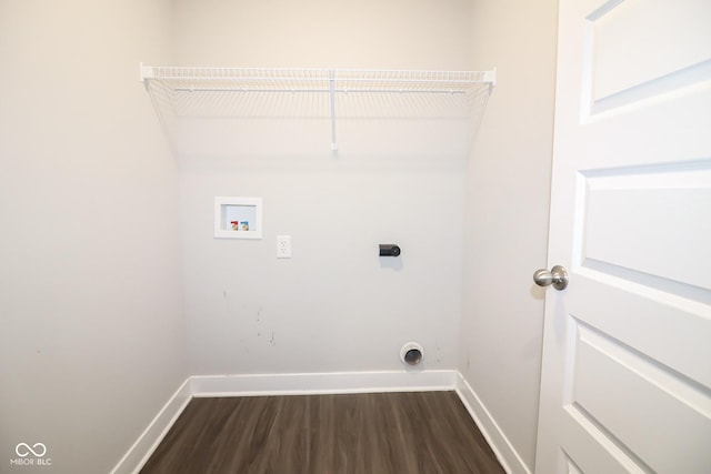 clothes washing area featuring electric dryer hookup, dark wood-style floors, baseboards, hookup for a washing machine, and laundry area