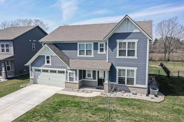 view of front facade with covered porch, board and batten siding, a front lawn, and fence