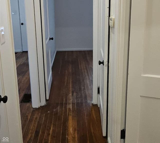 hall featuring dark wood-type flooring