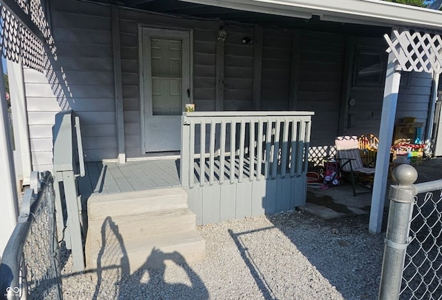 view of exterior entry with covered porch