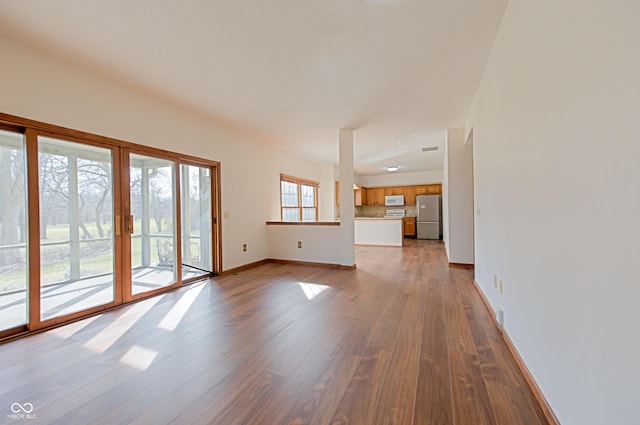 unfurnished living room featuring light wood-type flooring