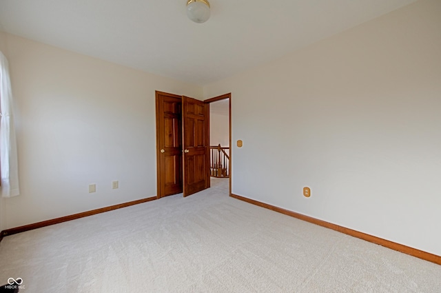 unfurnished room with carpet flooring