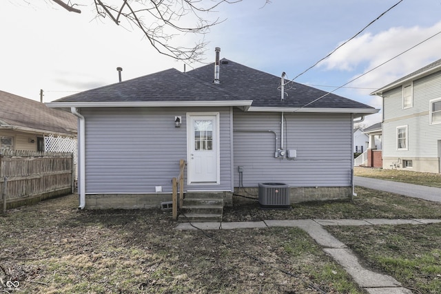 back of house featuring central AC unit