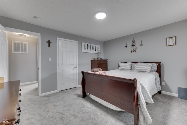 bedroom featuring light carpet