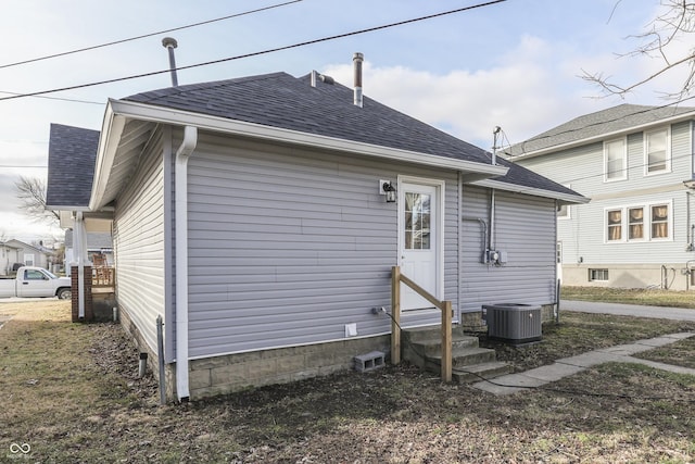 rear view of house with central air condition unit