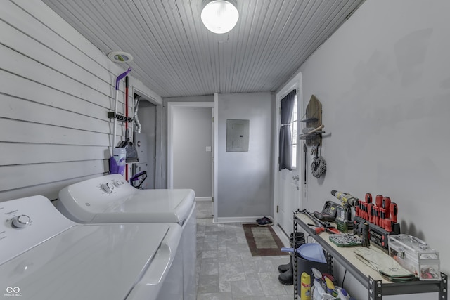 clothes washing area featuring washer and clothes dryer and electric panel