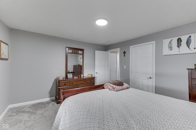 bedroom with light colored carpet