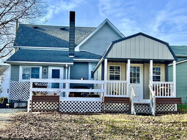 rear view of house with a porch