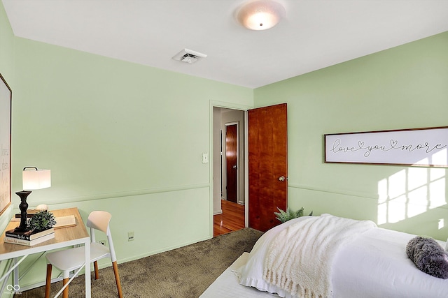 bedroom featuring carpet flooring and visible vents