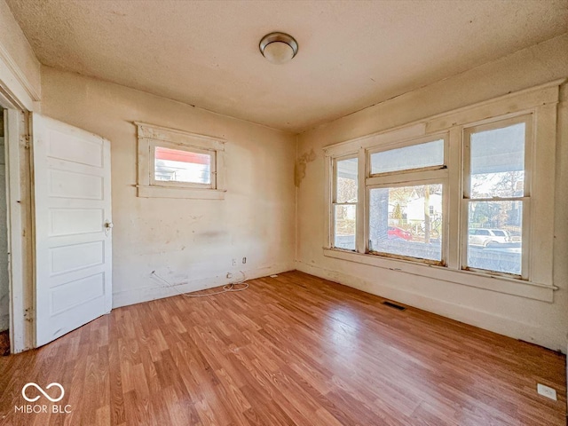 unfurnished room featuring hardwood / wood-style floors