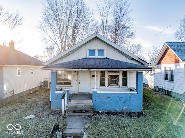 bungalow-style home with cooling unit and covered porch