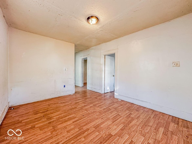 spare room with light hardwood / wood-style flooring