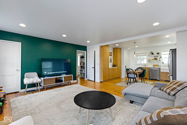 living room with light hardwood / wood-style floors